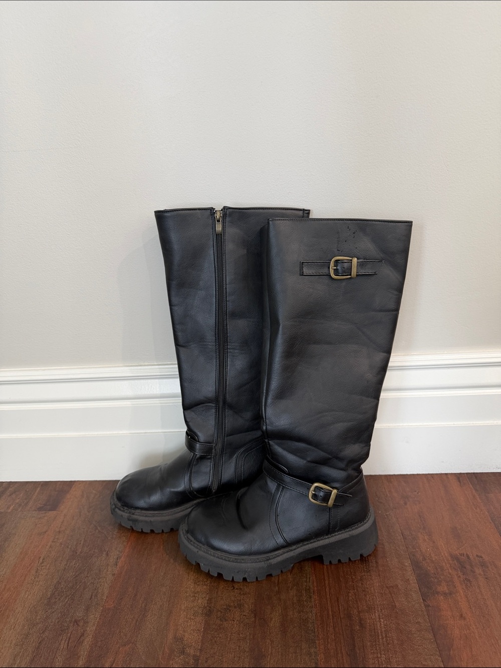 Black Leather Knee-High Riding Boots with Buckle Detail